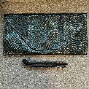 Black faux snake skin clutch.